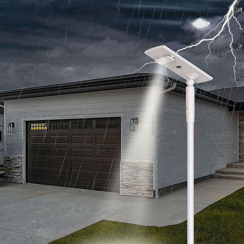 Residential Solar Street Light IP65 waterproof installed on pole in heavy rain thunderstorm garage driveway