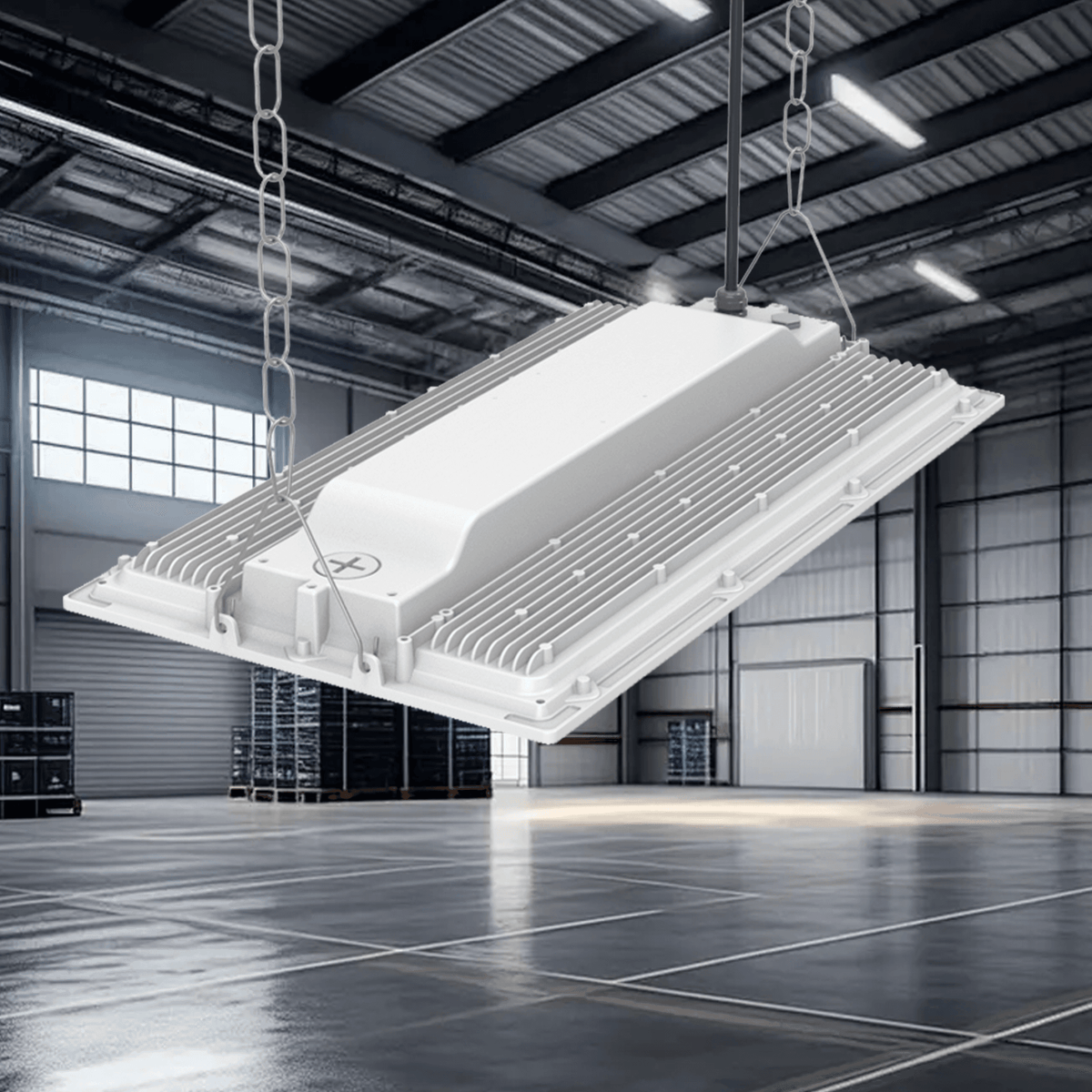 AEH2 LED Linear High Bay Light Back View Suspended by Four-Point Chain in Industrial Warehouse Showing Ribbed Aluminum Heat Sink Structure and Central Driver Housing