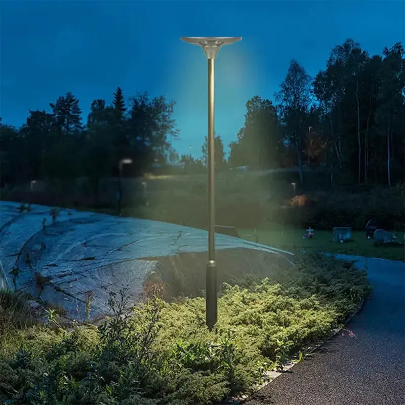 BT1 Solar LED Garden Post Light 30W-40W Installed in Garden Pathway at Night Providing Warm White Ambient Illumination for Landscape Design

