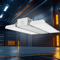 AEH3 LED Linear High Bay Light 100W-300W Microwave Sensor Dimmable Suspended in Dark Industrial Warehouse Showing Bright White Illumination from Dual-Row LED Panel
