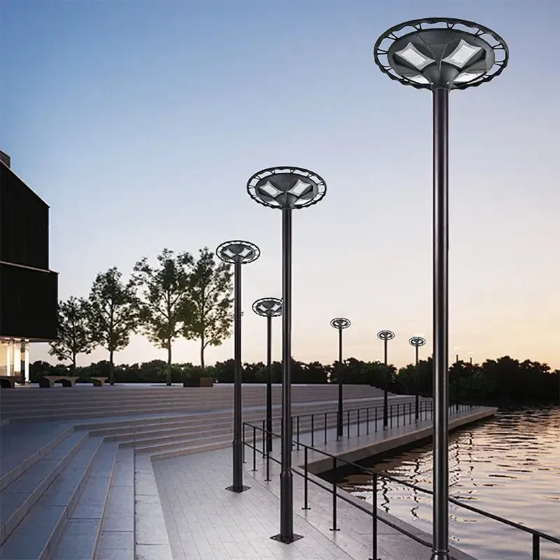 BT1 Decorative Garden Post Light 30W-40W UFO Style LED Pole Light Installed Along Waterfront Plaza at Dusk for Landscape Illumination

