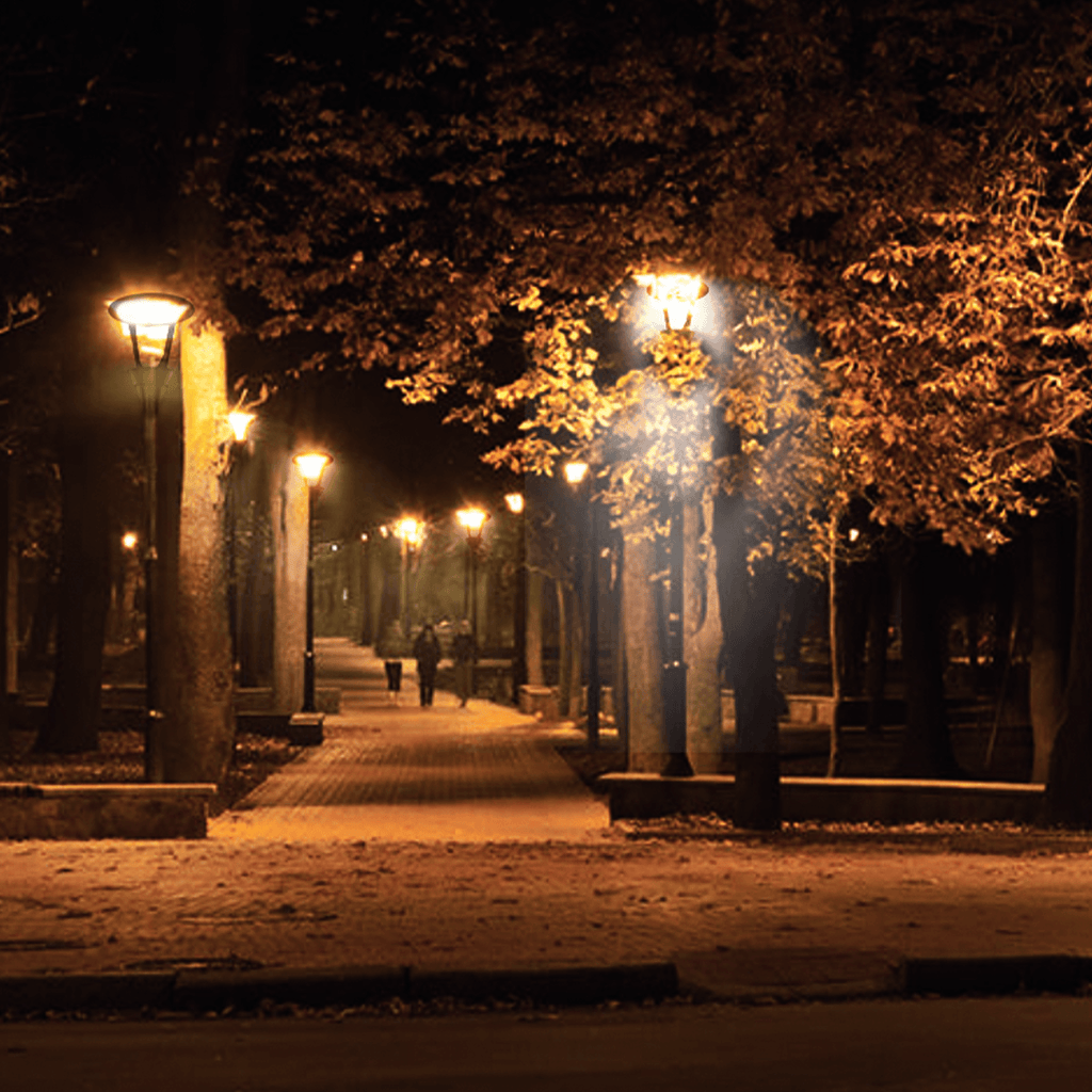 AEH3 LED Garden Post Light Warm White Night Illumination Along Tree-Lined Park Walkway in Autumn Showing Row of Cone Frame Post Lights for Outdoor Landscape Lighting
