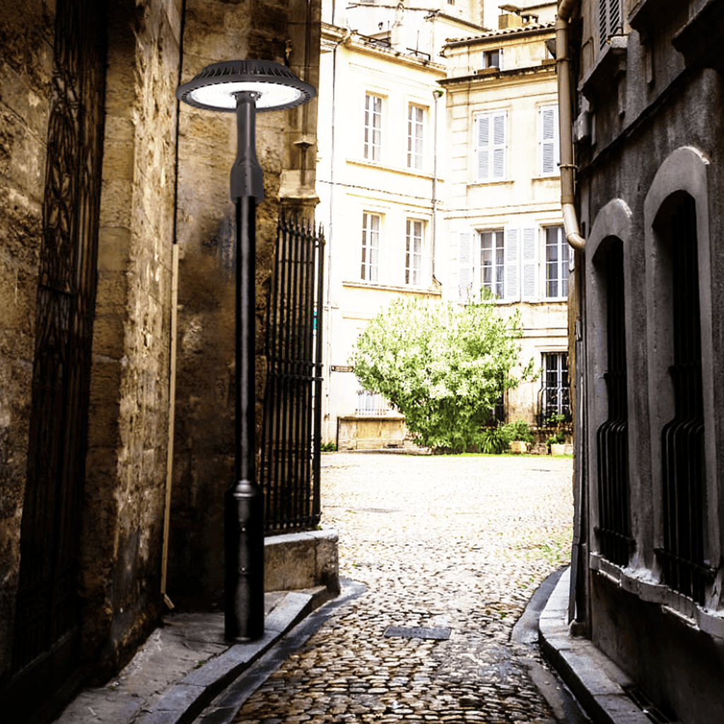 AEH1 LED Garden Post Light Bright Night Illumination in Narrow Brick Alley Showing Wide-Angle Light Distribution for Pathway and Garden Lighting