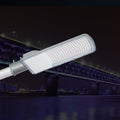 CL6 LED Street Light 50W-200W mounted on pole at night with bridge background