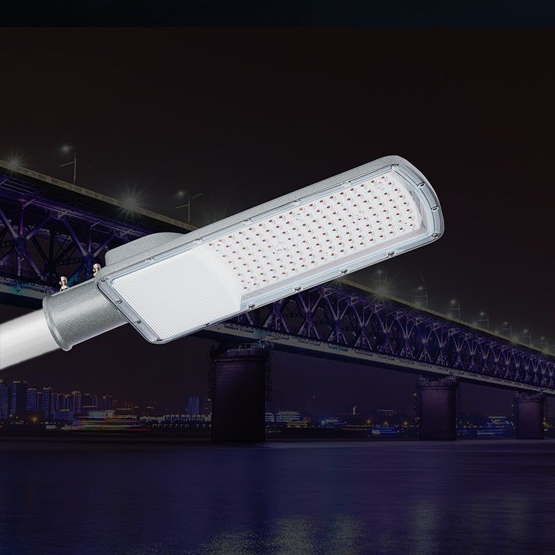 CL6 LED Street Light 50W-200W mounted on pole at night with bridge background