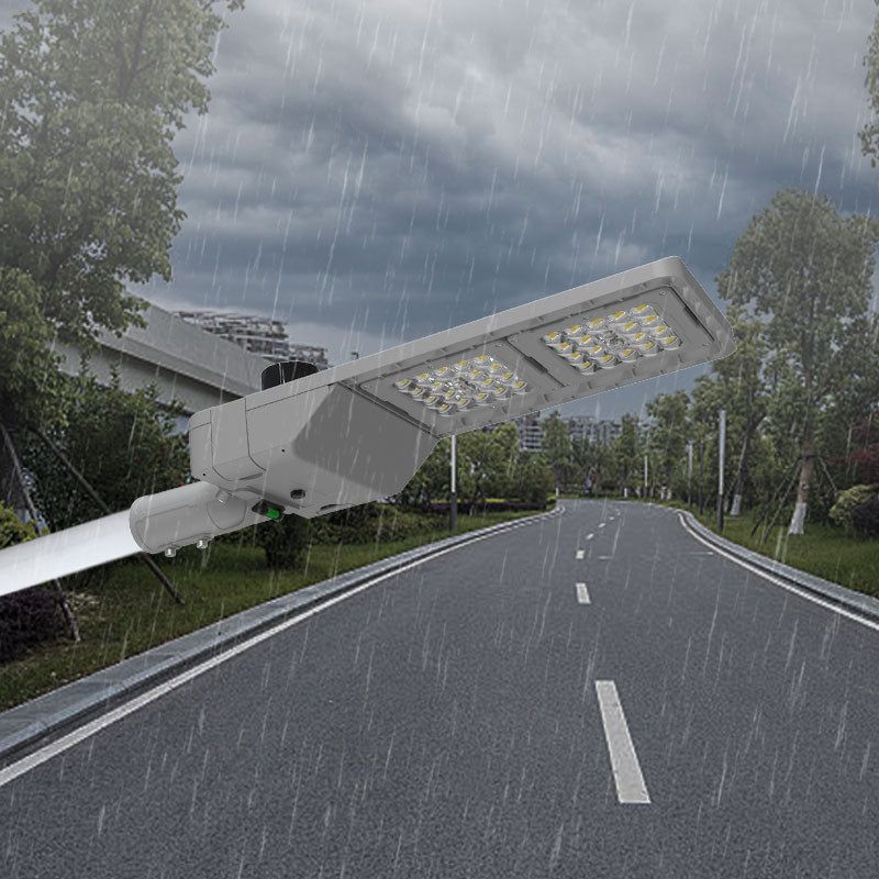 AEH6 LED Street Light IP65 Waterproof Outdoor Installation on Road Pole in Heavy Rain Demonstrating All-Weather Durability

