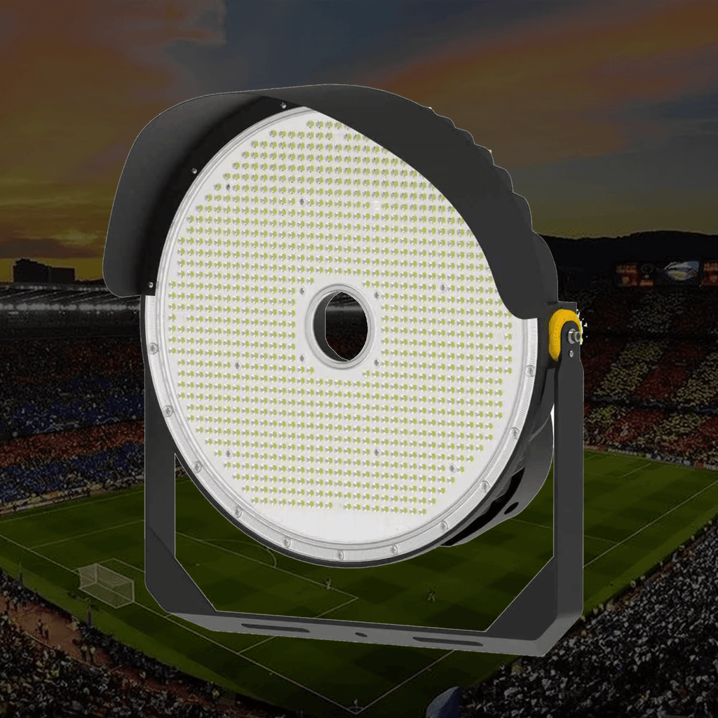 CL6 LED Sports Stadium Floodlight 300W to 800W Circular High-Density SMD LED Panel with Central Round Cable Port Black Aluminum Side Visor Wings and Yellow Tilt Lock Knob Installed Outdoors Against Dusk Football Stadium Background
